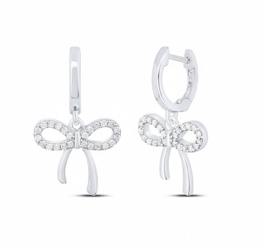 Sterling silver bow dangling earrings with 1/5 cttw natural diamonds, elegant and feminine design.