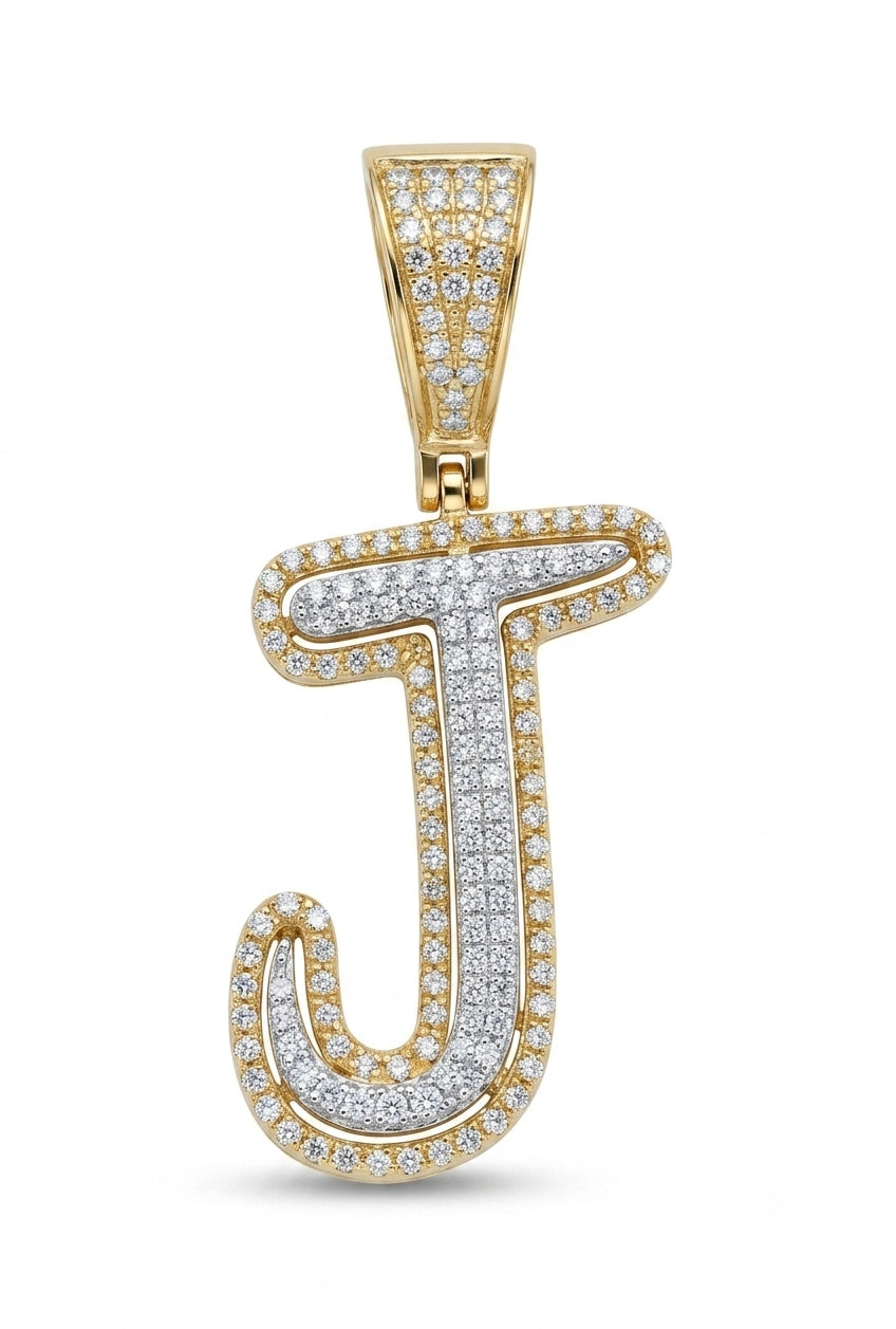 Gold and silver 'J' pendant with diamonds on a white background