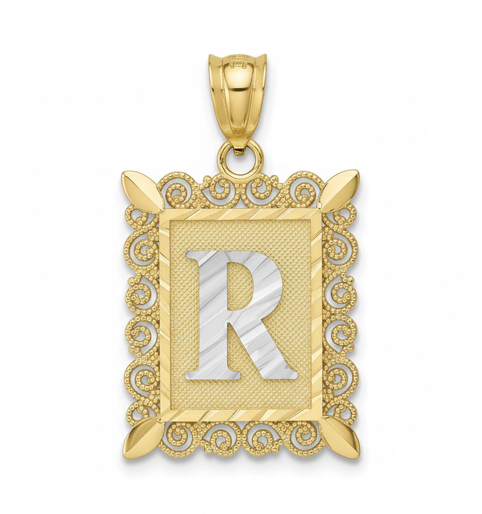 Gold pendant with letter 'R' on a white background