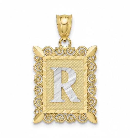 Gold pendant with letter 'R' on a white background