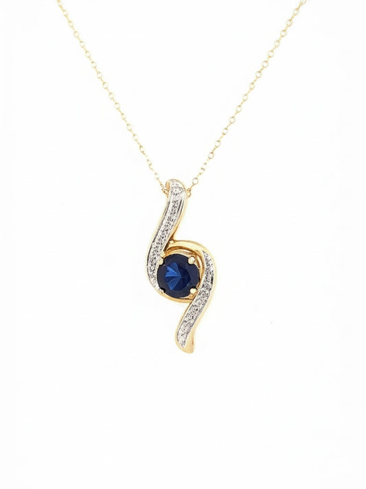 10K gold pendant featuring a 1.02 carat oval blue sapphire with diamond accents
