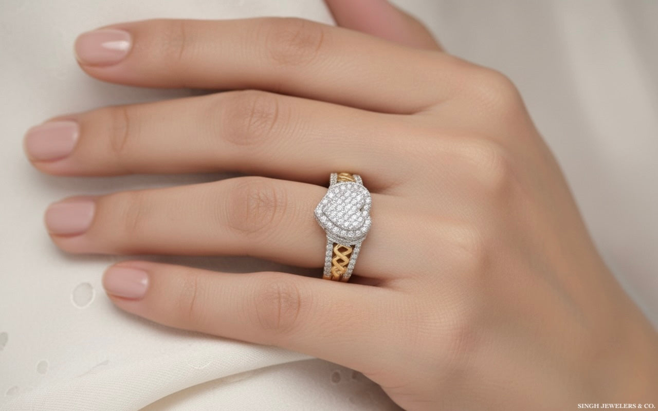 Hand wearing a diamond ring with a white background