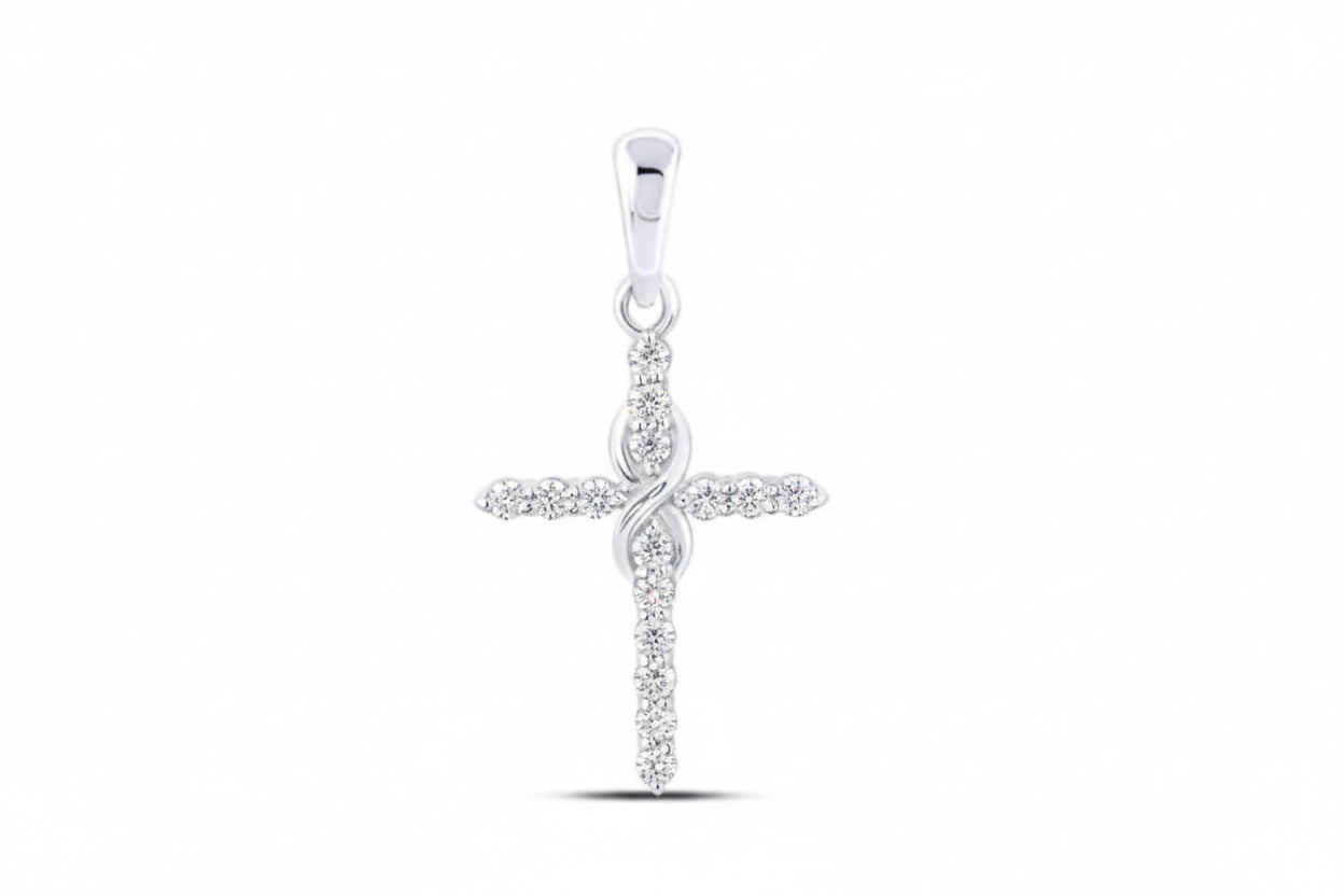 Silver cross pendant with small diamonds on a white background