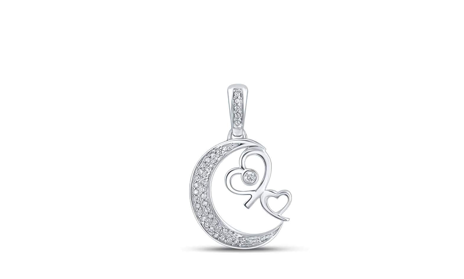 Close-up of 1/10 cttw diamonds in 10K gold crescent moon hearts charm