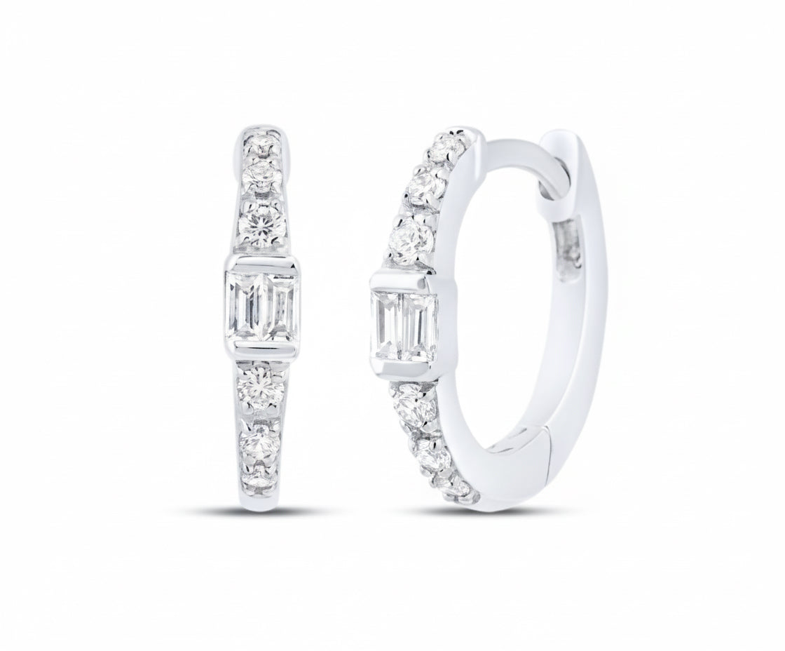 Close-up detail of princess cut diamond set in gold hoop earring