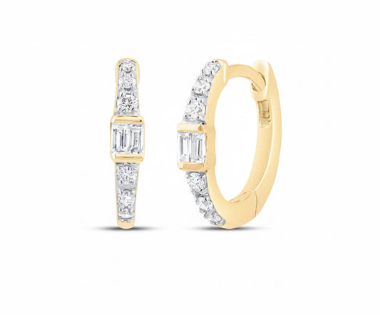 Close-up detail of princess cut diamond set in gold hoop earring
