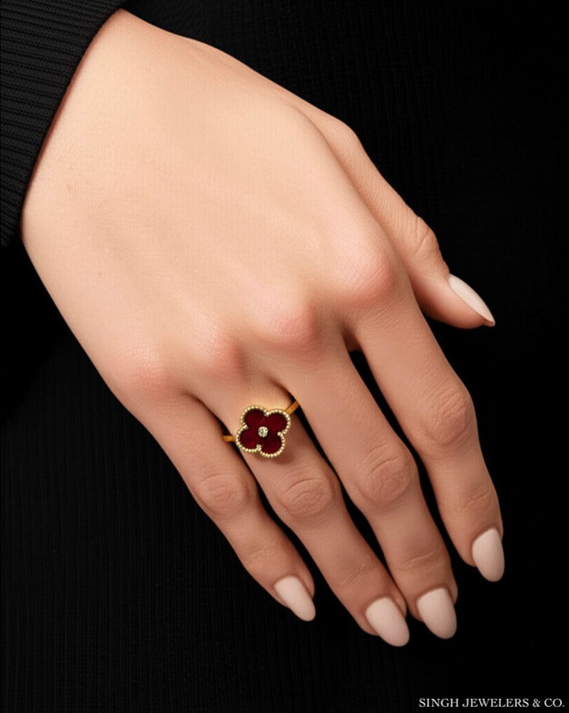 Model wearing 10K gold red clover ring with 1/10 CT diamond accents – designer-inspired fine jewelry