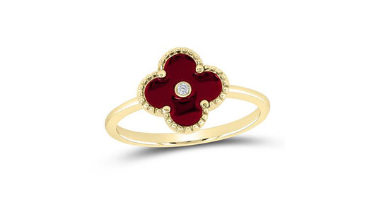 Model wearing 10K gold red clover ring with 1/10 CT diamond accents – designer-inspired fine jewelry