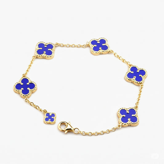 10K royal blue bead bracelet with five 12mm clovers and one 6mm gold clover charm
