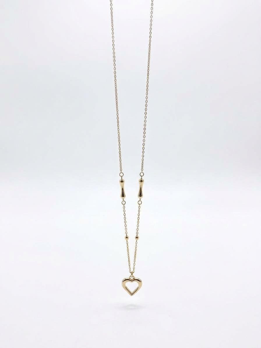 Solid 10K gold heart necklace with T-bone design