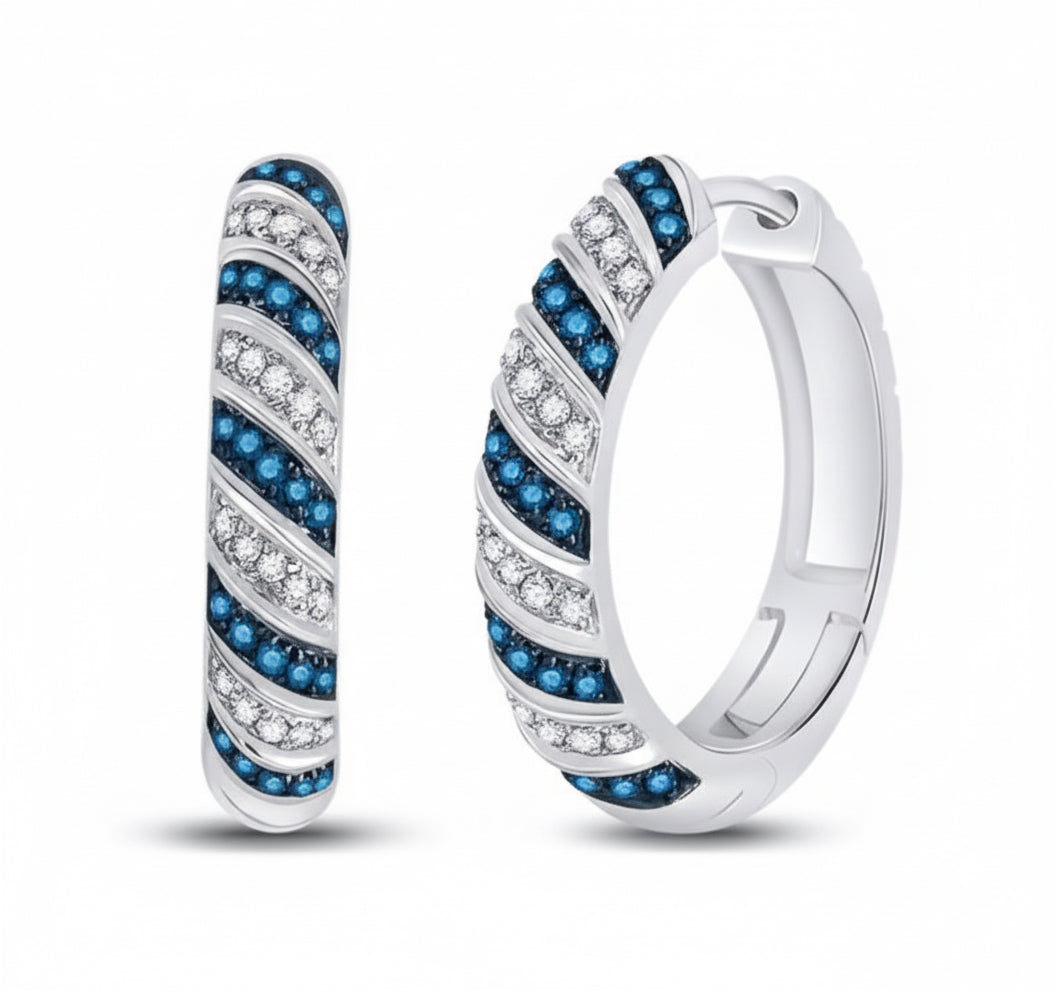 Close-up of striped hoop earrings with blue diamonds