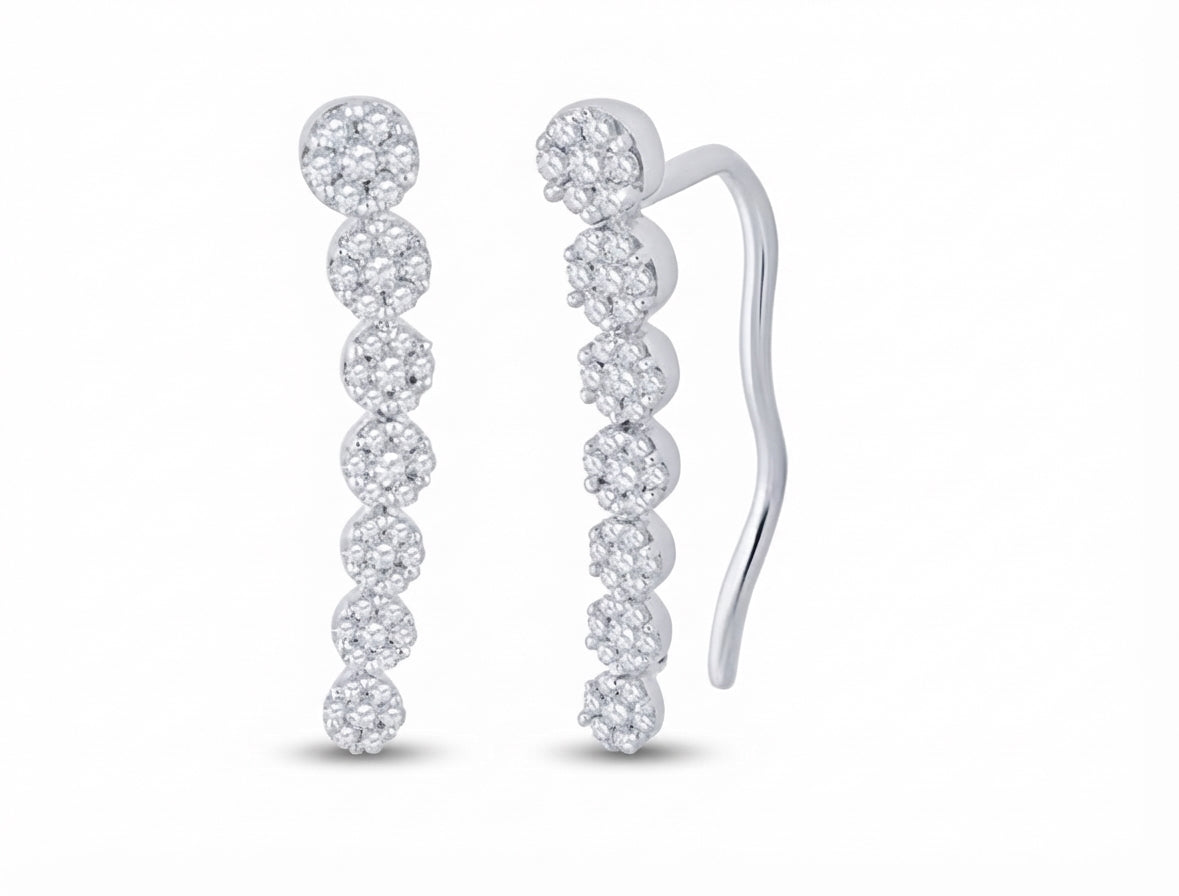 Close-up of 10K white gold diamond climber earrings with round diamonds