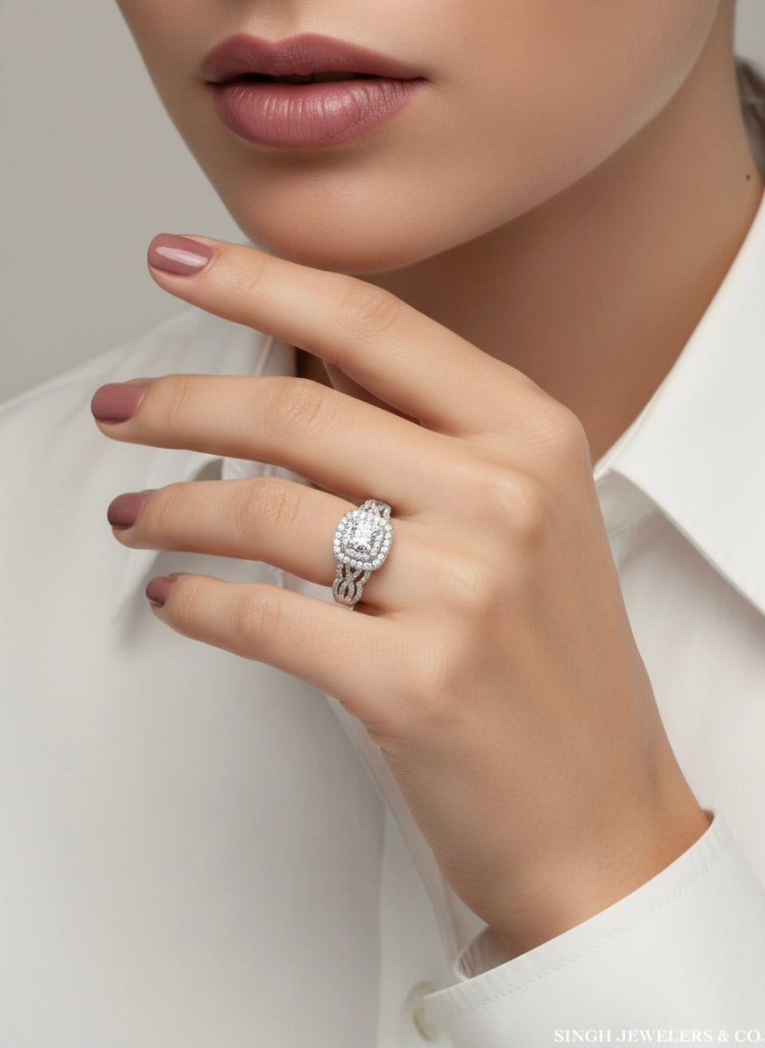Close-up of a hand wearing a diamond ring with a neutral background