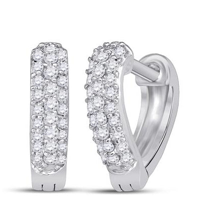 Front view of 10K white gold heart huggie earrings with 1/5 Cttw diamonds, elegant and sparkling.