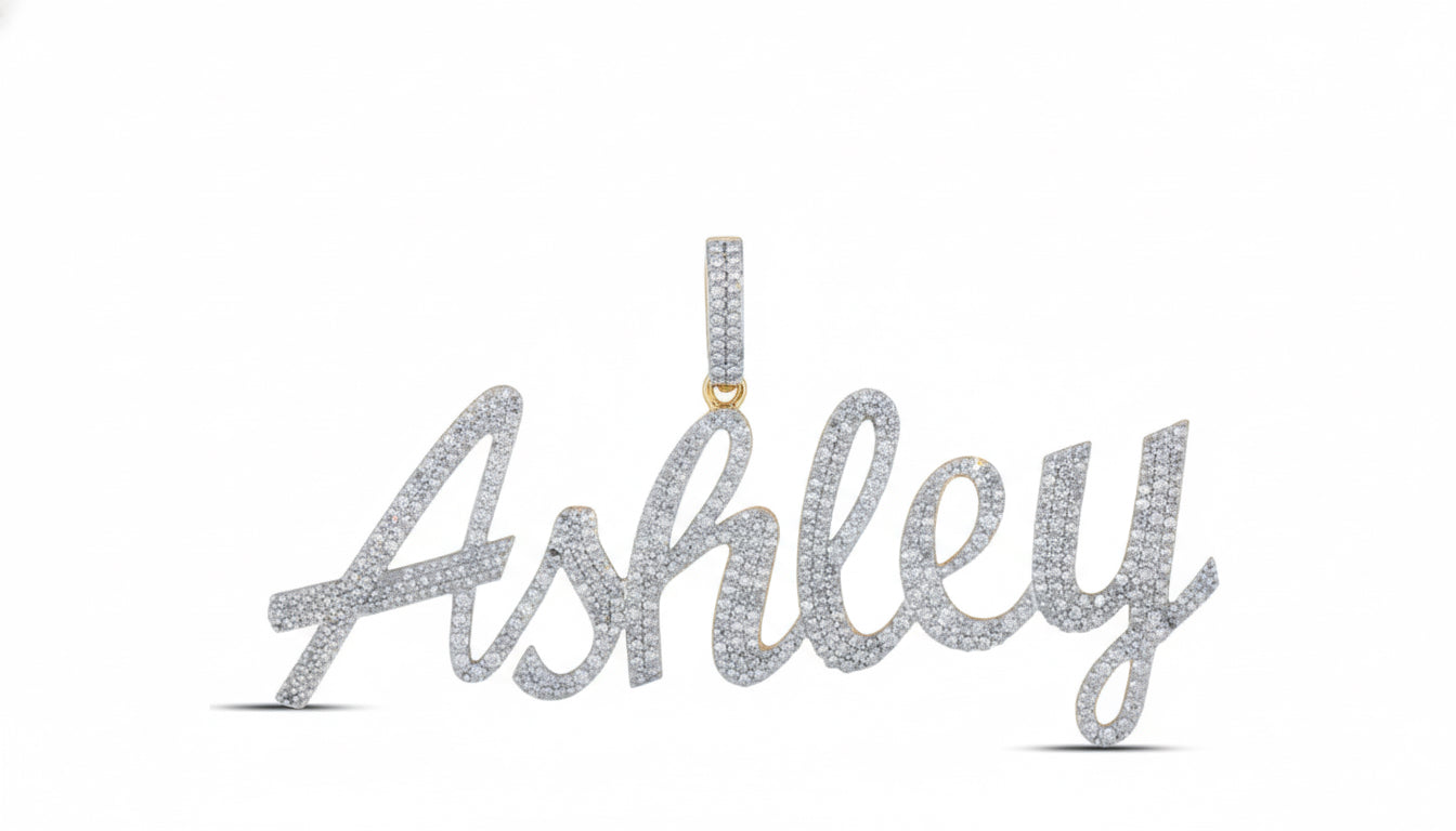 A 10K yellow gold diamond name pendant with the name 'Ashley' engraved in a cursive script.