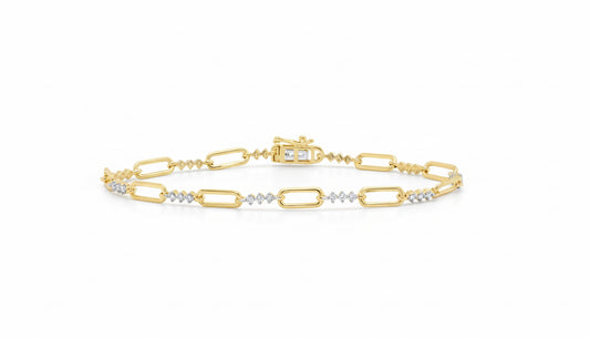 Gold bracelet with diamond accents on a white background