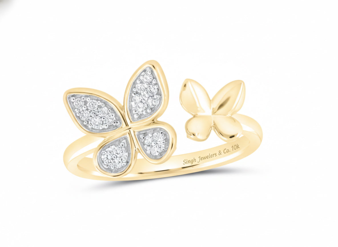 Close-up of round diamonds on 10K yellow gold butterfly ring