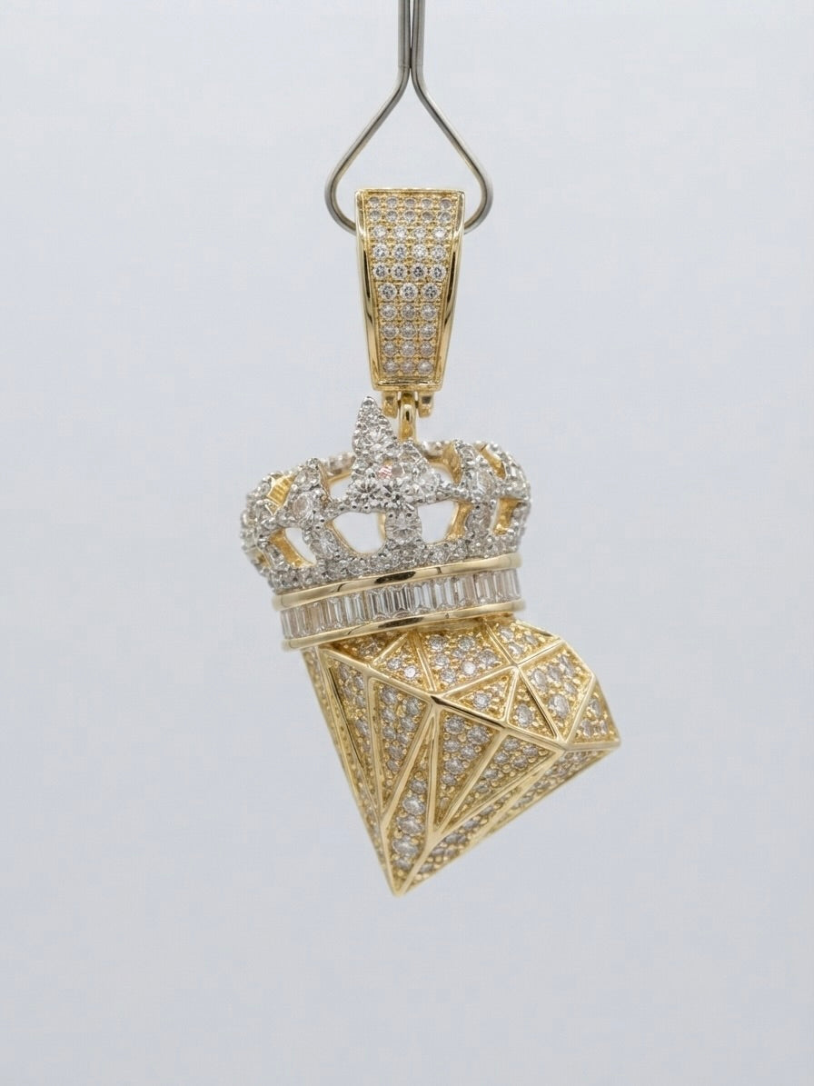 Close up of diamond gem crown pendant in yellow gold 10K jewelry