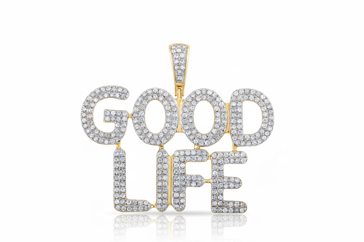 Gold and silver 'GOOD LIFE' pendant on a white background