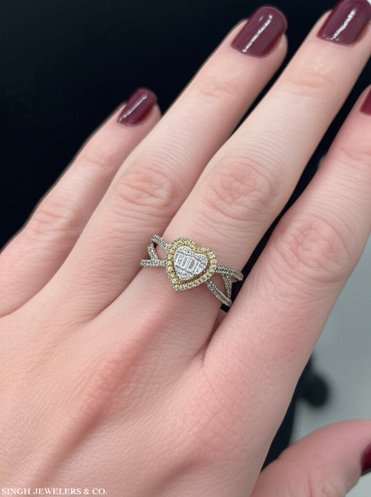 Elegant 10K yellow gold heart-shaped emerald-cut diamond ring worn on hand