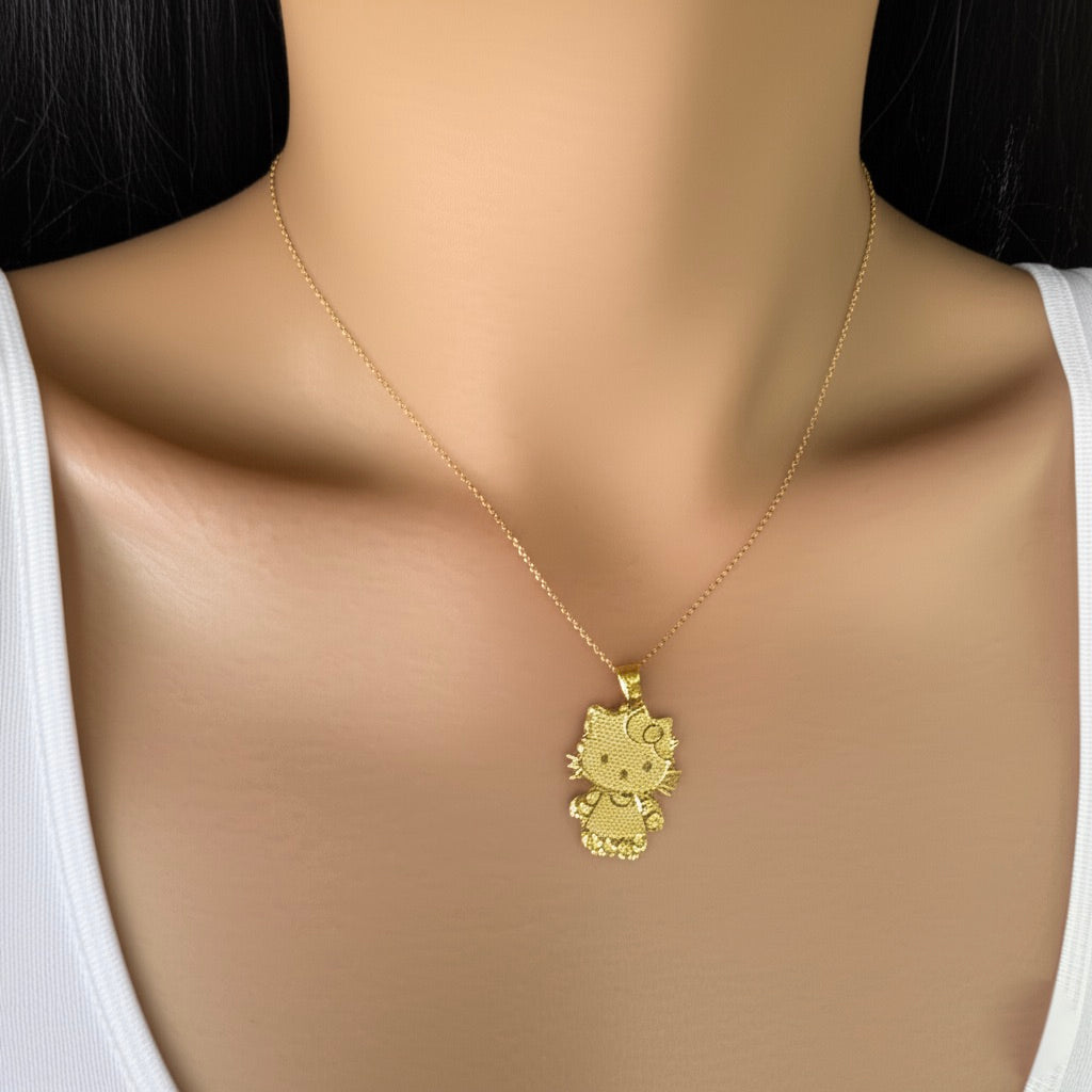 Gold necklace with a Hello Kitty pendant on a mannequin