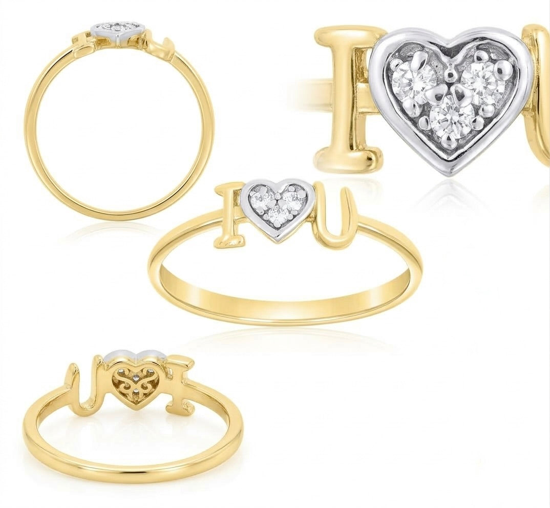 Close-up of the heart design and cubic zirconia details on a gold ring