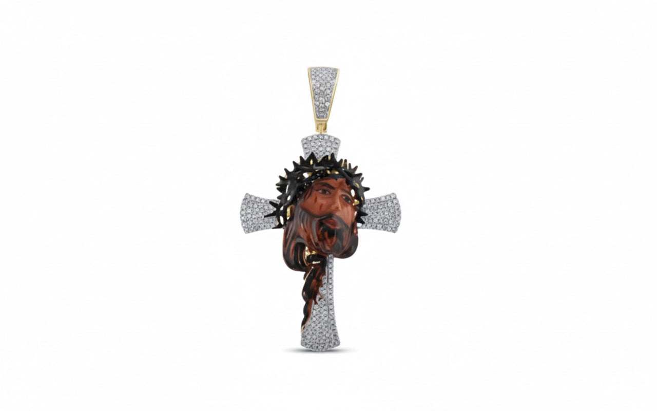 10K yellow gold Jesus pendant with 1/2 carat round diamonds and enamel detailing. Chain not included.