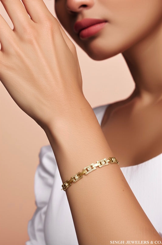 Woman wearing 10k yellow gold diamond cut bracelet on wrist
