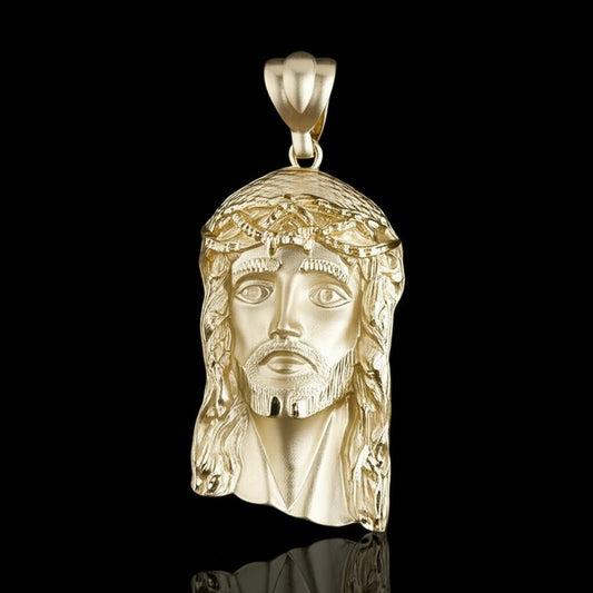 10K yellow gold matte finish Jesus pendant with detailed religious design