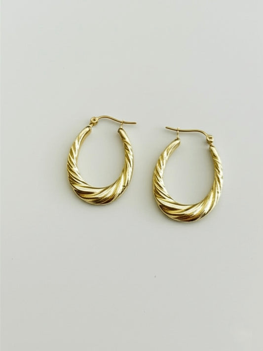 10K Yellow Gold Twisted Oval Hoop Earrings on white background