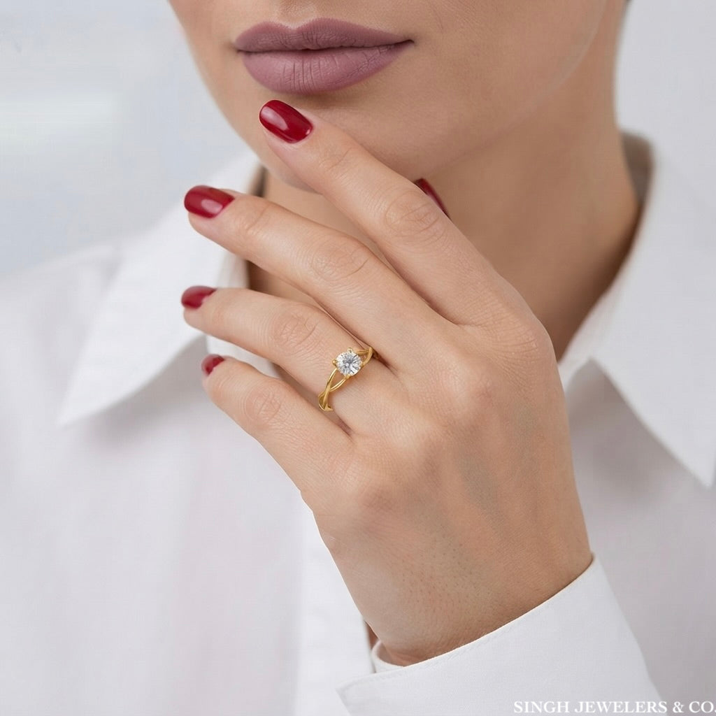 10K yellow gold women's infinity engagement ring with round cubic zirconia on woman
