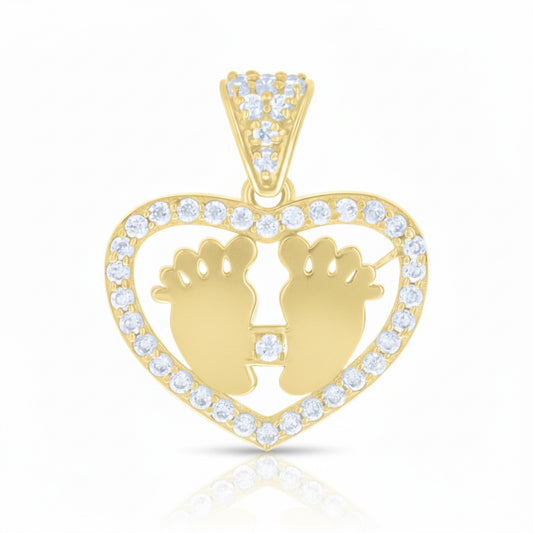 Gold pendant with heart design and baby feet silhouette on a white background