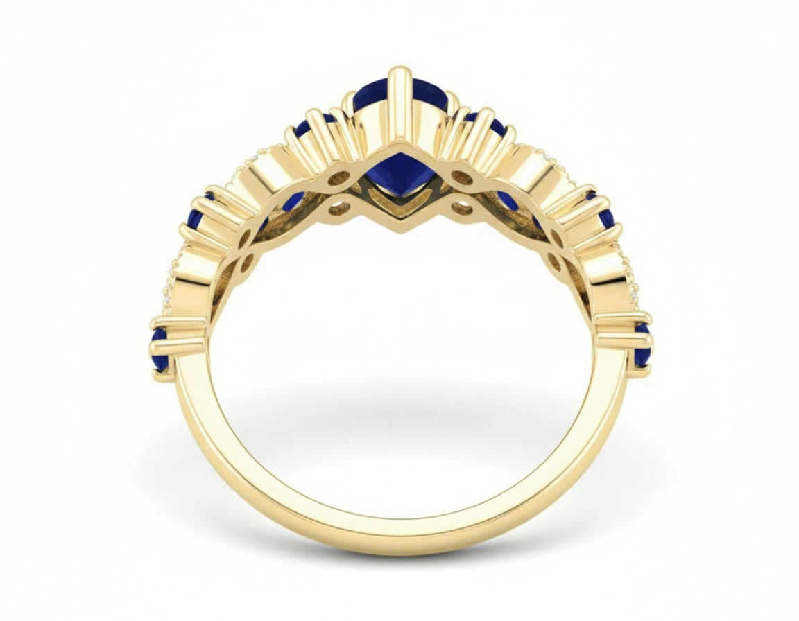Gold ring with blue gemstones on a white background