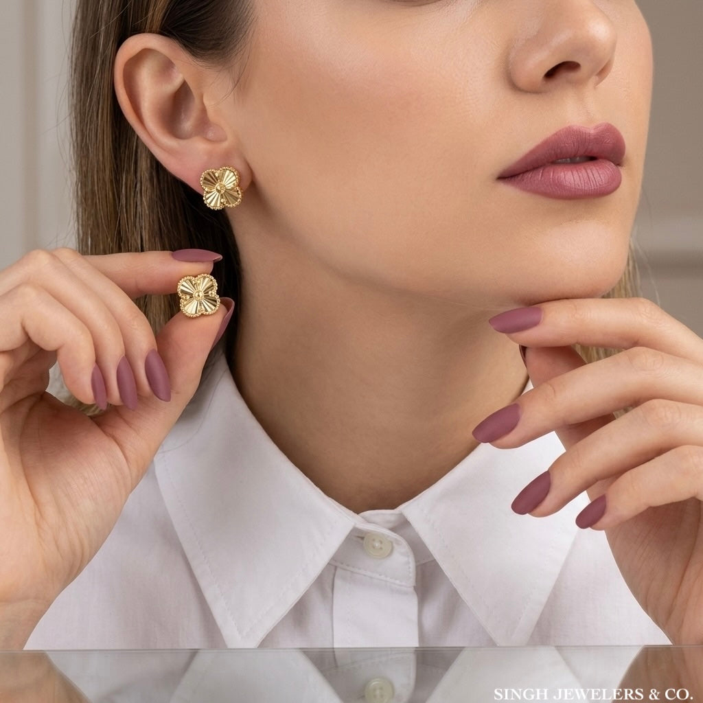 Model wearing 14k gold clover earrings as elegant everyday jewelry vancleef