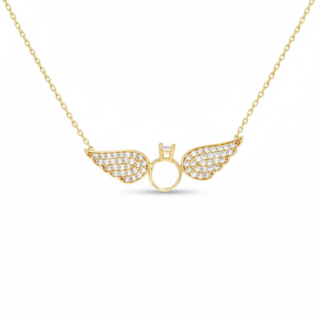 Gold necklace with angel wing pendant on a white background