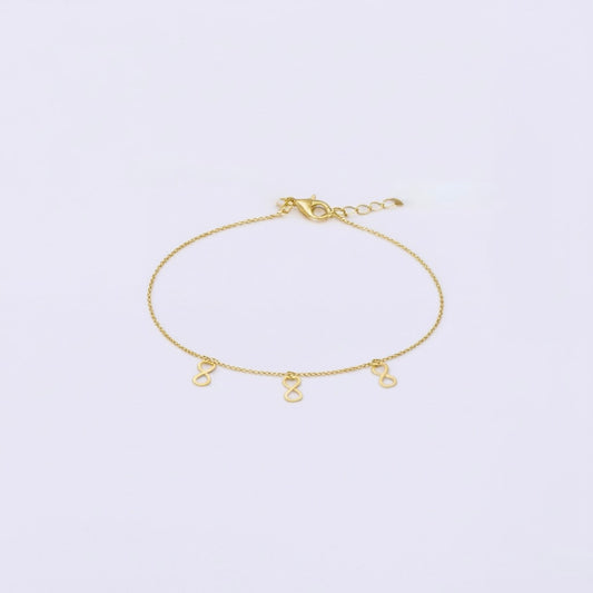 14K gold infinity anklet with adjustable 1-inch extension for women.