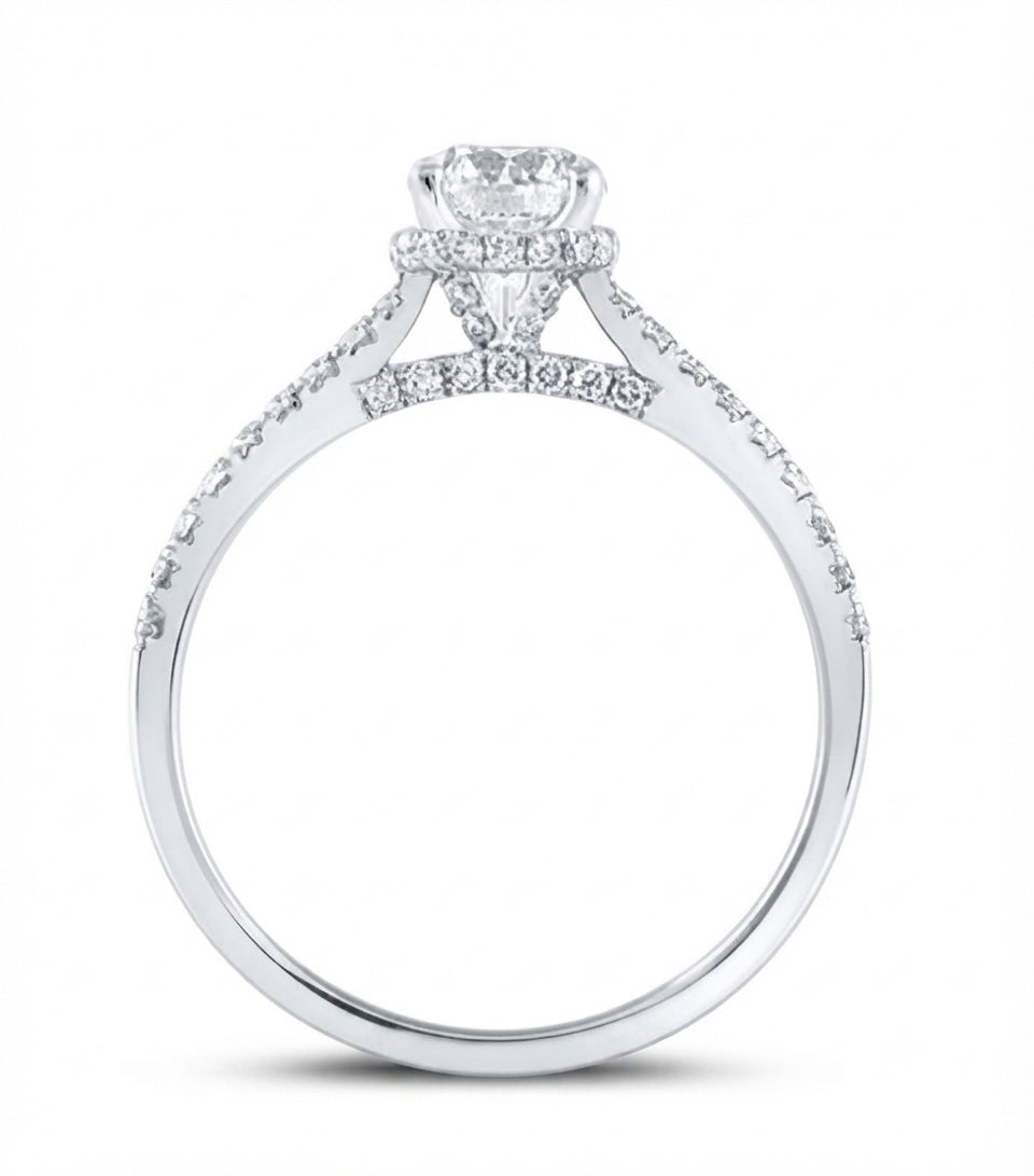 A white gold diamond engagement ring featuring a heart-shaped center stone and pavé-set diamonds along the band, shown on a plain white background.