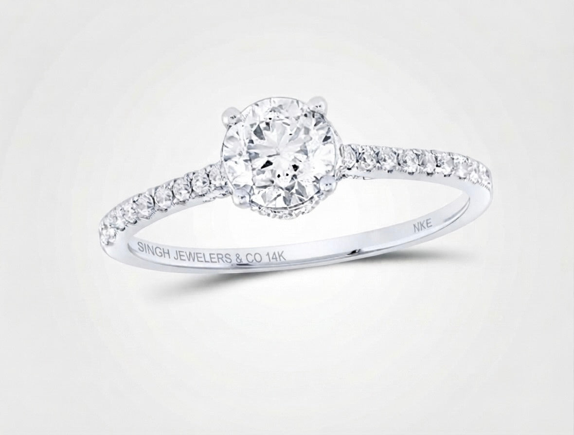 14K gold, this engagement ring offers both lasting durability and sophisticated beauty. Its minimalist design highlights the center diamond, creating a look that remains effortlessly elegant for generations.