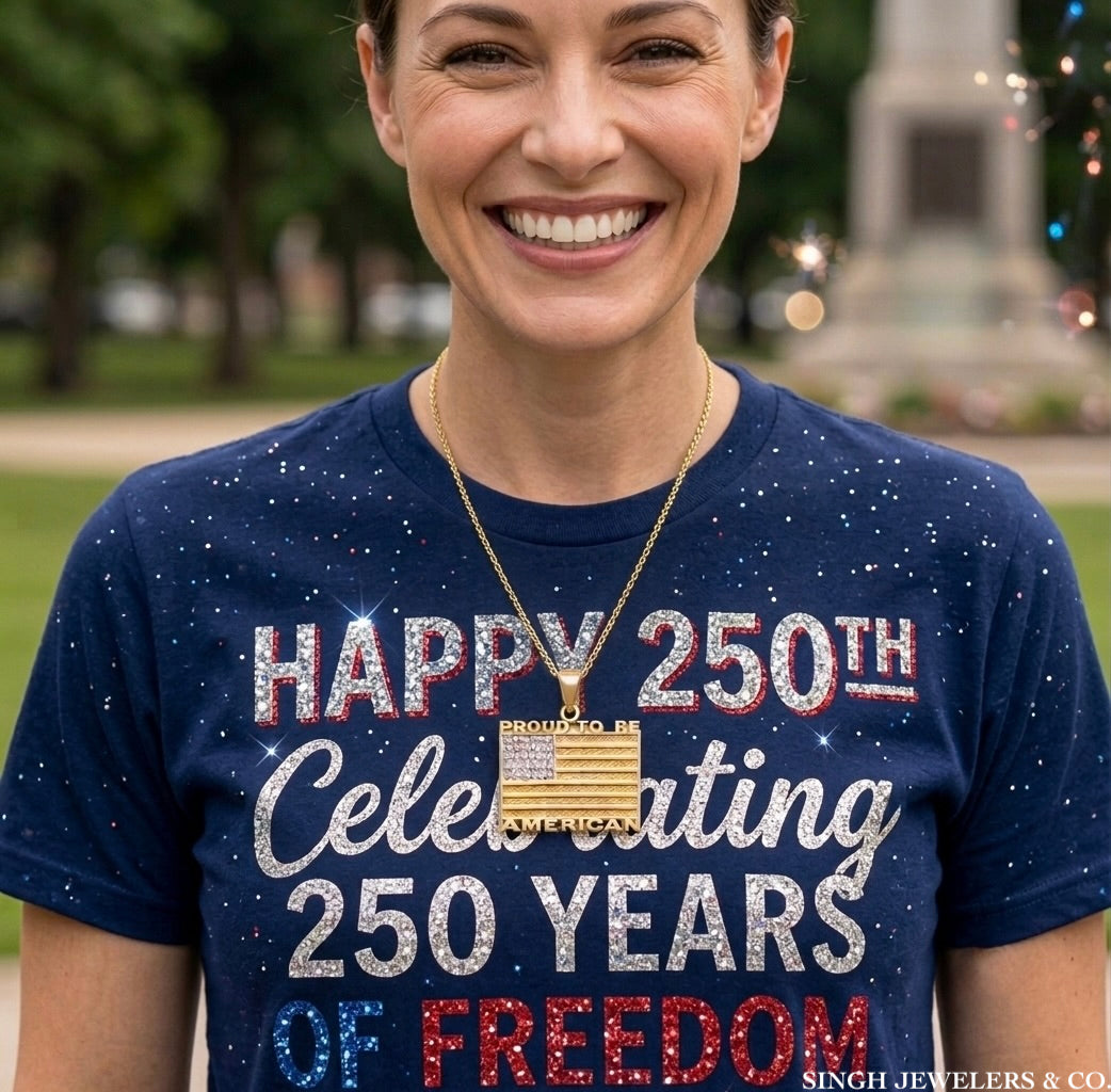 Person wearing a blue t-shirt celebrating 250 years of freedom with visible jewelry.