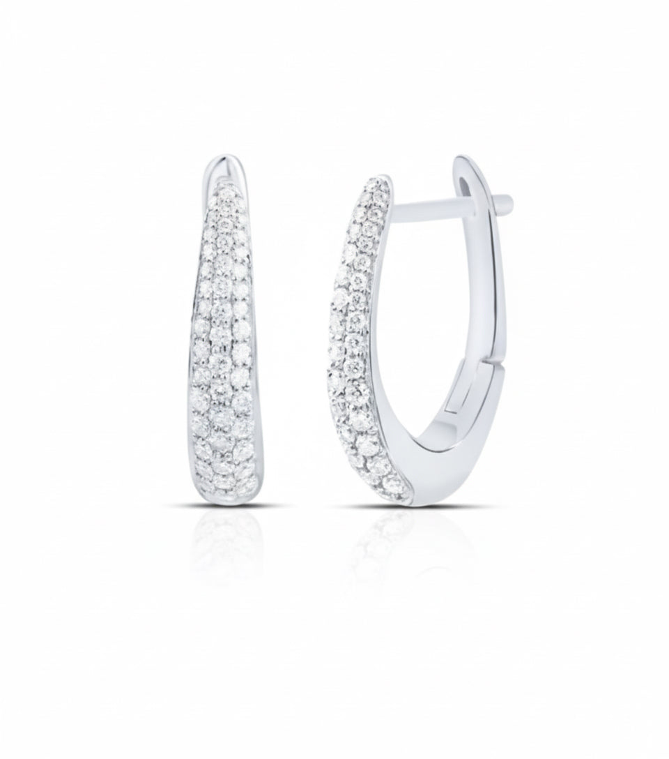 Silver hoop earrings with clear gemstones on a white background