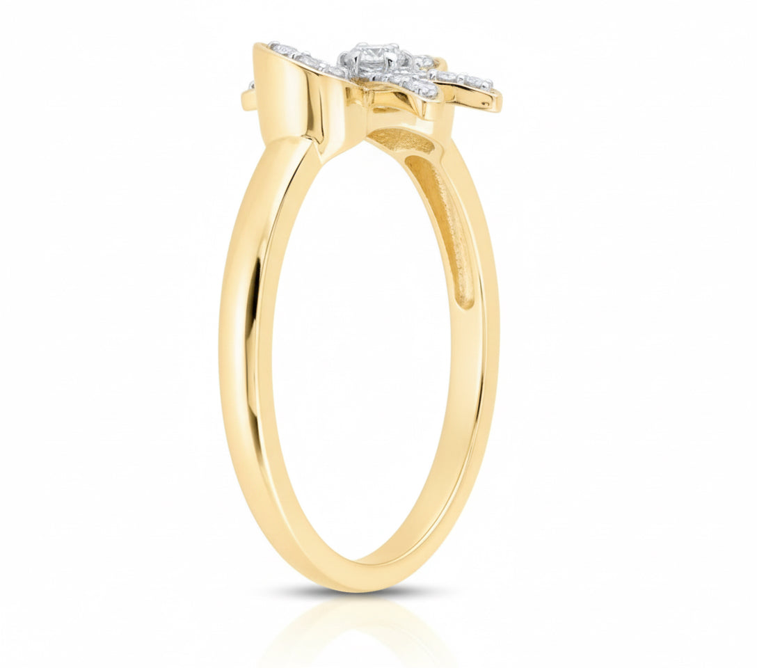 Gold ring with diamond accents on a white background