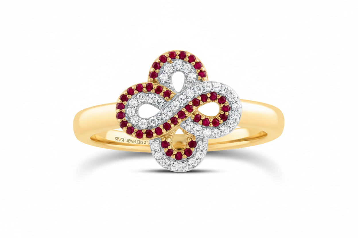 14k yellow gold infinity clover ring with 1/8 CTW diamonds and 1/6 CTW round ruby