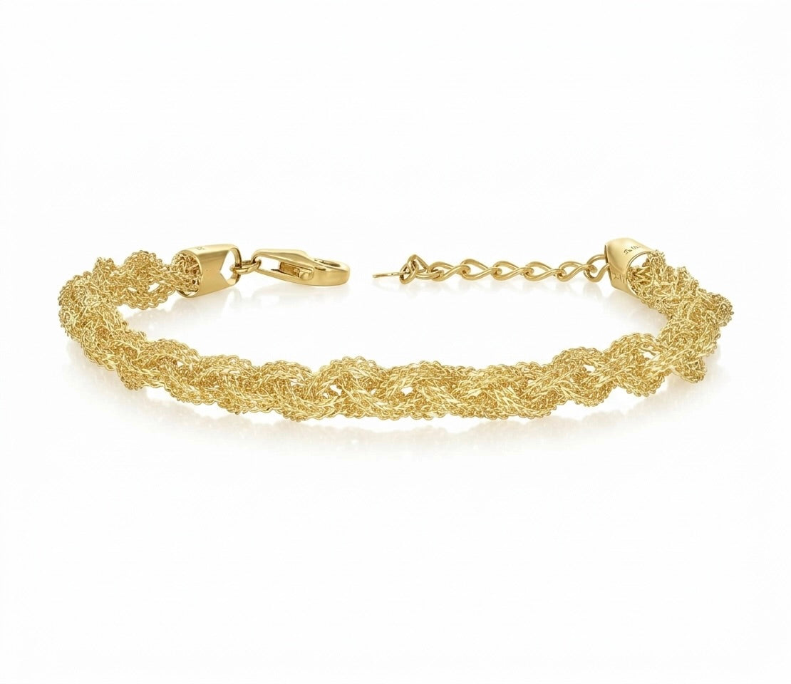 Close-up of the textured braided links on a yellow gold chain bracelet