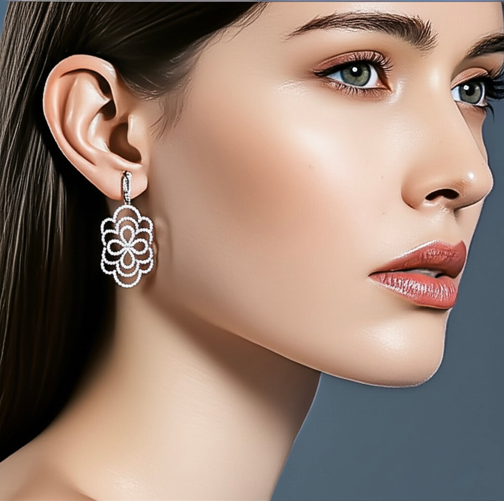 Close-up of a woman wearing a floral earring with a neutral background