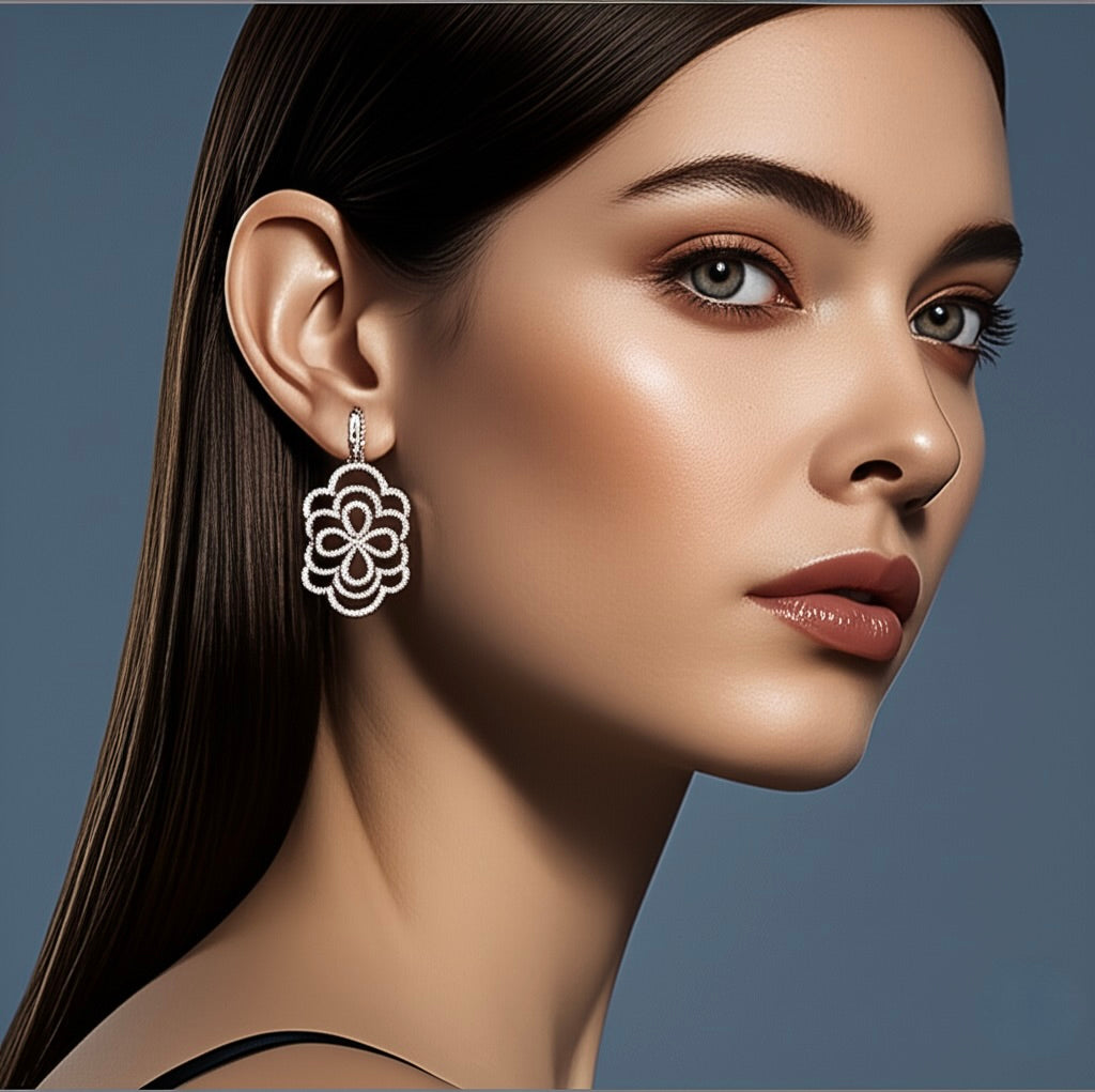 Close-up of a woman wearing a floral earring against a neutral background
