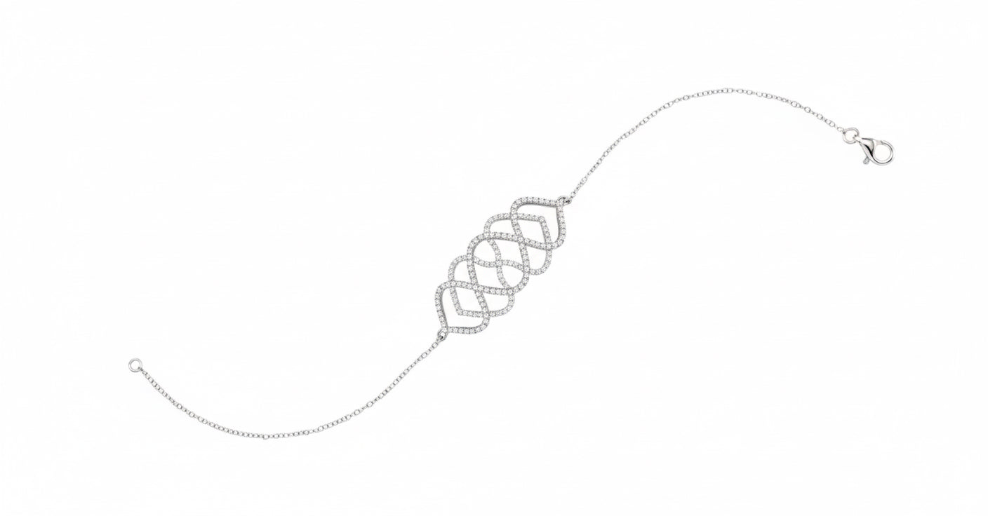 Silver bracelet with interlocking heart charms on a white background