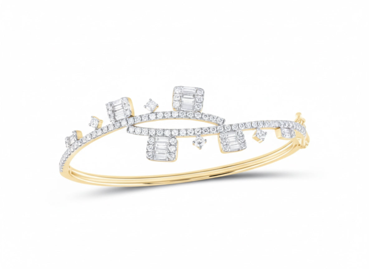 Gold and diamond bracelet on a white background