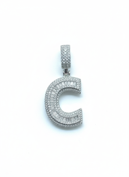 Silver crescent moon pendant with gemstones on a white background