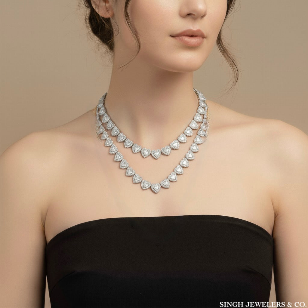 Woman wearing a diamond necklace with a beige background, featuring the brand 'Singh Jewelers & Co'.