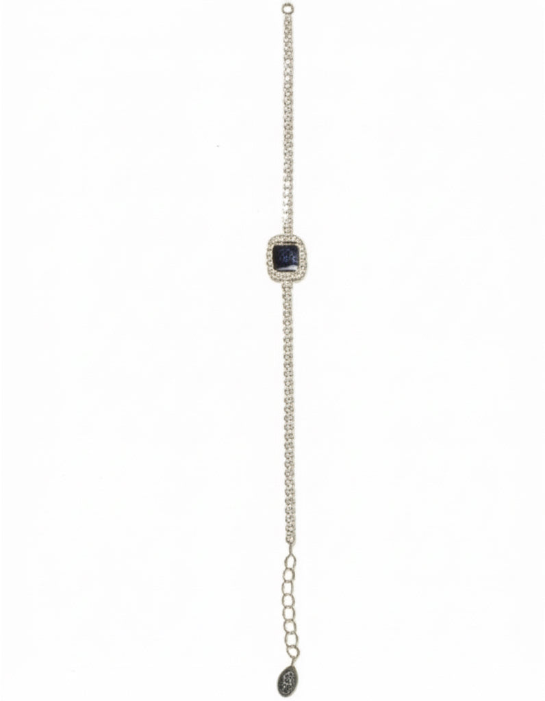 Close-up of 925 sterling silver bracelet showcasing synthetic blue sapphire and cubic zirconia stones